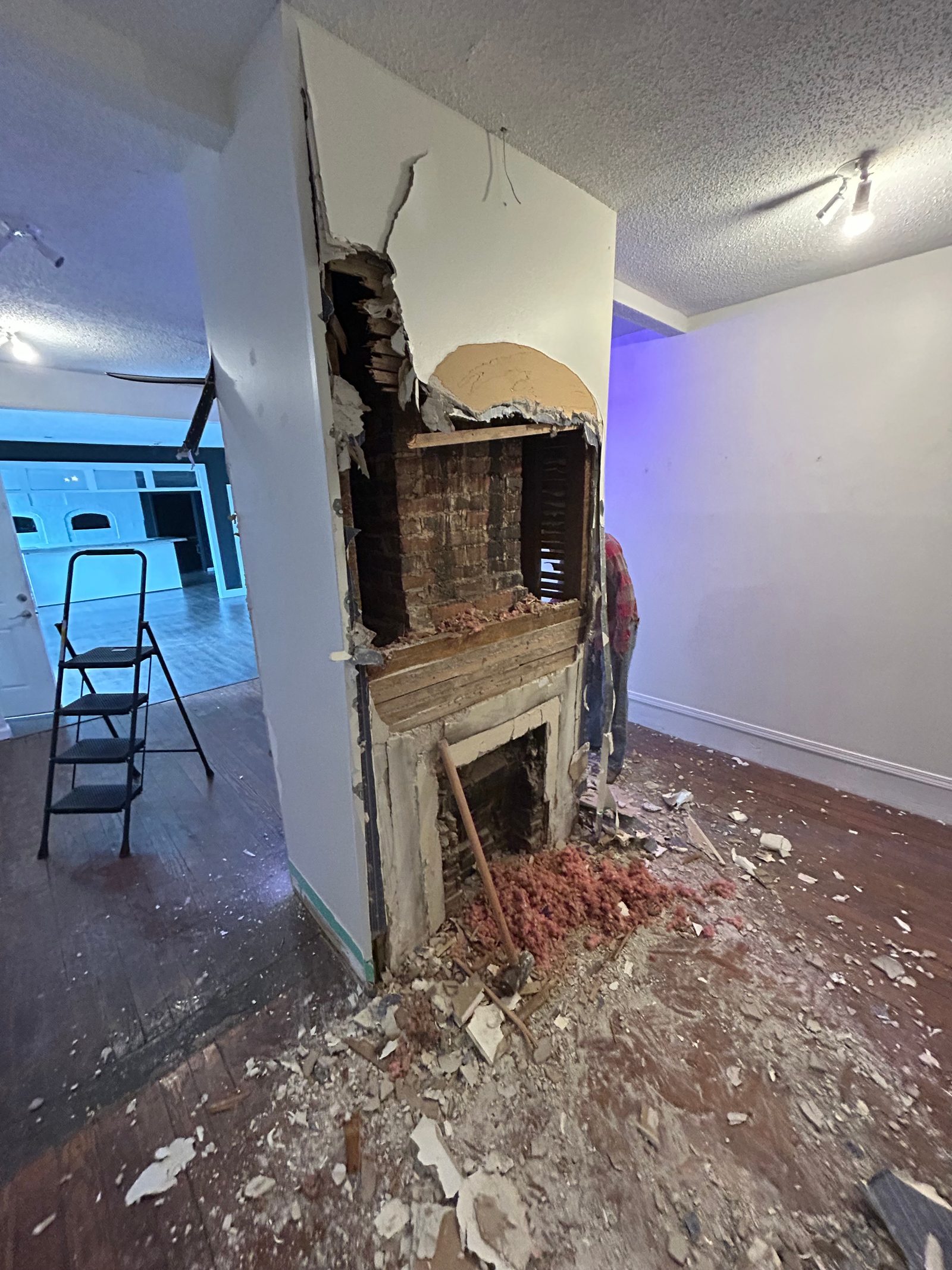 Wall opened up to studs and insulation during interior repair